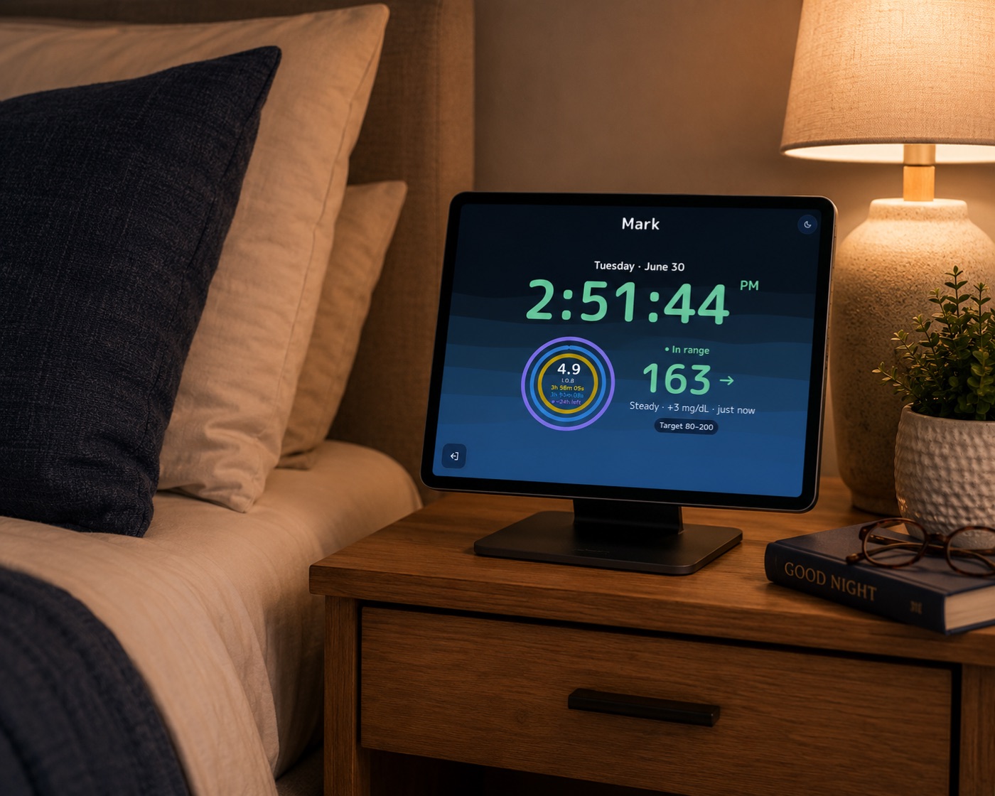 Sugalarm on a nightstand at night showing a glucose reading